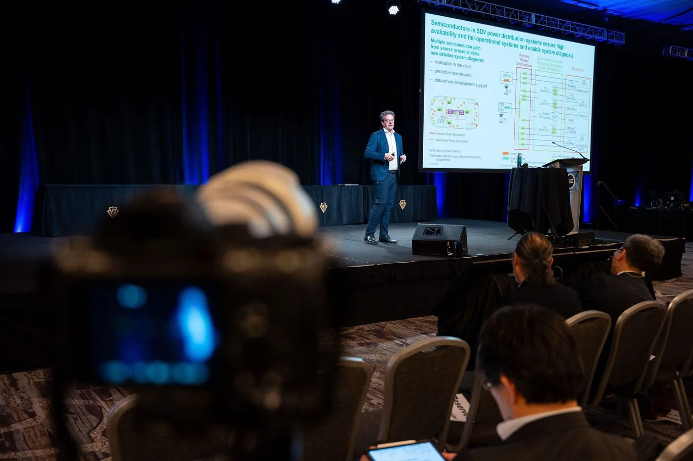 Camera position in front of a plenary stage at ISSCC 2025