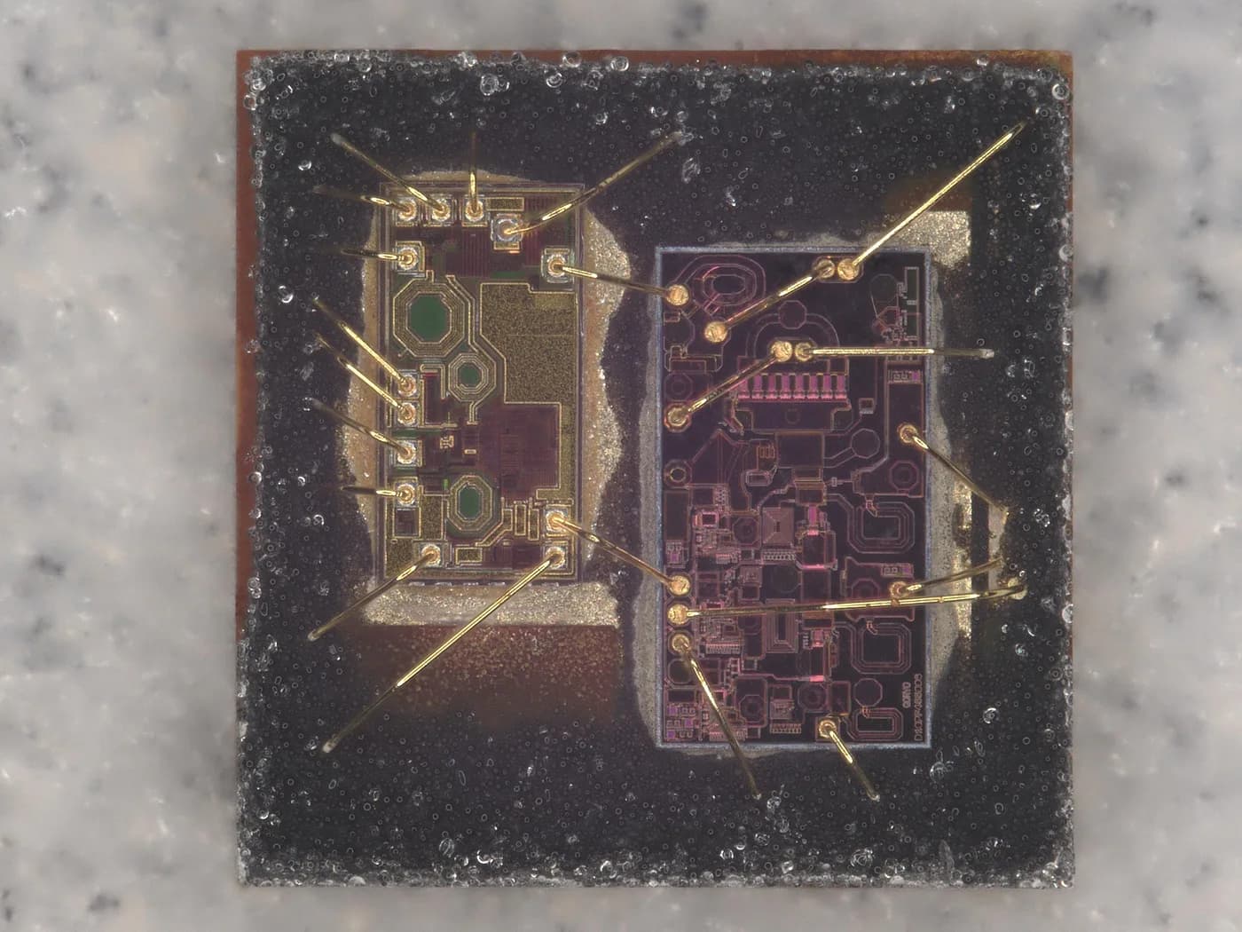 Decapped IC die showing bond pads and metal layers